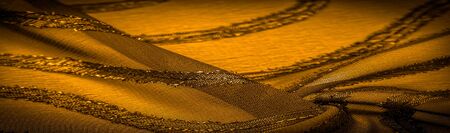 ornament of the decor, the fabric is transparent mustard yellow with brightly congenital stripes, the material allowing the light to pass through it so that the objects behind are clearly visibleの写真素材