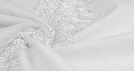 Texture, background, pattern, postcard, silk fabric, female white scarf with lace wrappers. Use these fancy images to create your print and digital materials.の写真素材