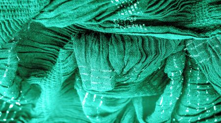 The texture of the background picture the color of the fabric under water, green-blue corrugated fabric, fabric with parallel or diagonal folds with serrated folds; products from such a fabric.の写真素材
