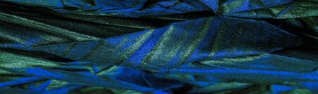 texture. background. pattern. wallpaper. black silk fabric with blue emerald stripes, wrinkled fabricの写真素材