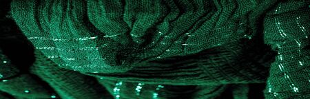 The texture of the background picture the color of the fabric under water, green-blue corrugated fabric, fabric with parallel or diagonal folds with serrated folds; products from such a fabric.の写真素材