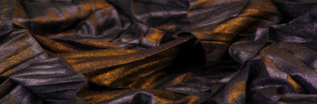 texture. background. template. wallpaper. black silk fabric with yellow golden stripes, wrinkled...