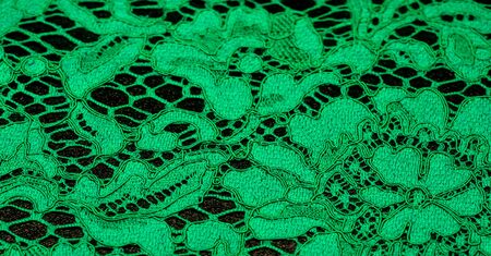 Texture, background, pattern, green lace fabric, Tender embossed lace fabric, scalloped on both edges. Suitable for your projects, design, etc.の写真素材