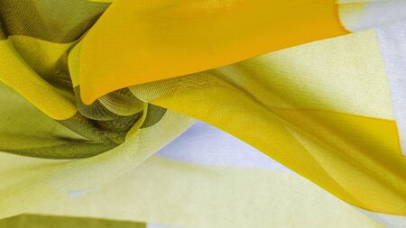 Texture, background, silk fabric pattern, oblong rhombus, bohemian print, decorative fabrics for your design and project accents, multicolor grunge yellow gray pale lilacの写真素材