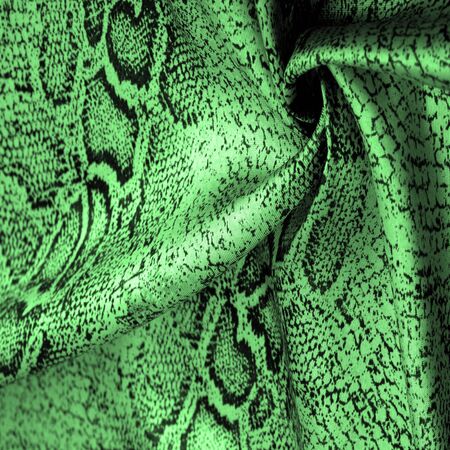 Texture, background, pattern, fabric with a green snake skin pattern, African fabric, designer photo - safari in the country of Africaの写真素材
