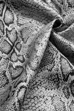 Texture, background, pattern, fabric with a pattern of gray snake skin, African fabric, design photo...