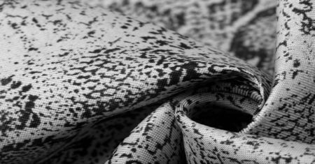 Texture, background, pattern, fabric with a pattern of gray snake skin, African fabric, design photo - safari in the country of Africaの写真素材