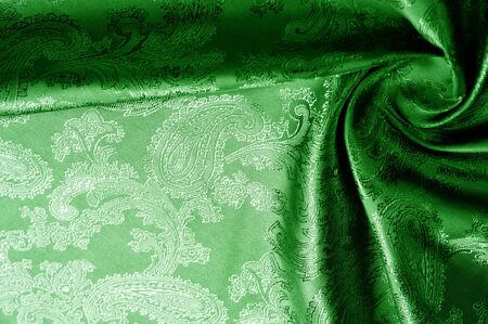 texture, background, green, verdant, lawny, vealy, virid,  blushful fabric with a paisley pattern. based on traditional Asian elementsの写真素材