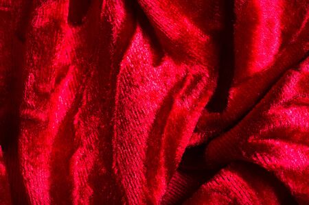 velor, cloth of red color. This gorgeous stretch velvet fabric has a velvety heap. Panne nap adds flicker and texture! It has a knitted back and is great for creating a stylish designの写真素材