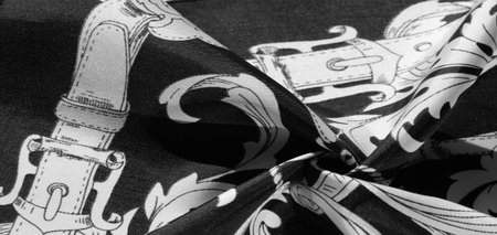 texture, background, black silk fabric with a monogram pattern Exquisite pattern of filigree fabric...