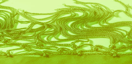 Background texture of silk fabric. This is a natural green salad scarf, this beautiful nylon satin...