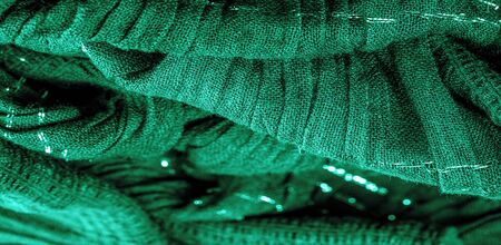 The texture of the background picture the color of the fabric under water, green-blue corrugated fabric, fabric with parallel or diagonal folds with serrated folds; products from such a fabric.の写真素材
