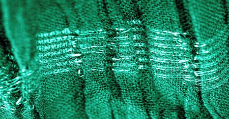 The texture of the background picture the color of the fabric under water, green-blue corrugated fabric, fabric with parallel or diagonal folds with serrated folds; products from such a fabric.の写真素材