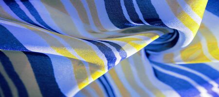 Background texture. multicolored striped silk fabric. Mexican coloring theme bright colored striped pattern with abstract stripesの写真素材