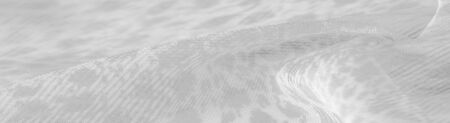 The texture, background, pattern, white silk fabric is textile. Its properties differ from woven material in that it is more flexible and easier to design.の写真素材