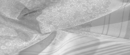 Texture pattern, black gray silk fabric on a white background, flowers pattern silhouette on white...