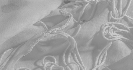Background, pattern, texture, wallpaper, white silk fabric has a brilliant shine. This is the most...