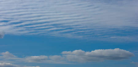 Texture background, pattern, wallpaper. They are still quite high clouds. They do not give rain. Altostratus clouds have an average level of gray or blue-gray. usually cover the whole sky.の写真素材