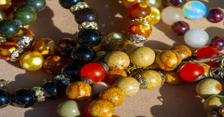 Texture, background, pattern. Folk art. Beads from multi-colored stones and glassの写真素材