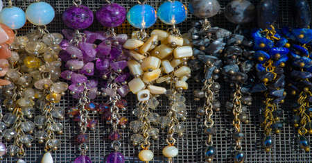 Texture, background, pattern. Folk art. Beads from multi-colored stones and glassの写真素材