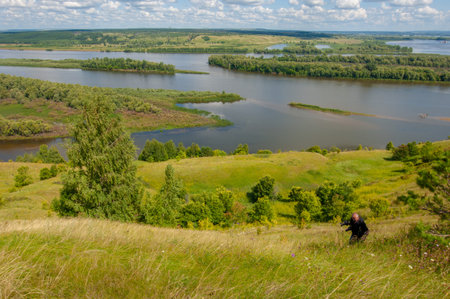 Summer landscape, river a large natural stream of water flowing in a channel to the sea, a lake, or...