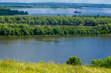 Summer landscape, river a large natural stream of water flowing in a channel to the sea, a lake, or...