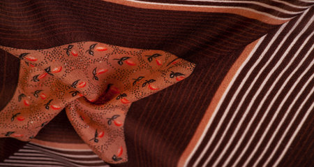 silk fabric, brown background with striped pattern of white and red lines, spanish theme, texture,...