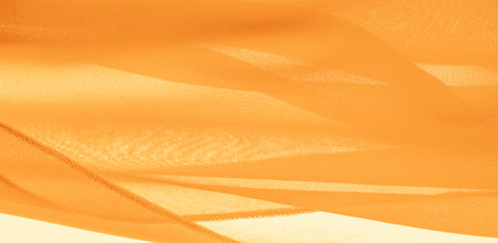 Yellow silk fabric. It is perfect for your designs, accents, wallpapers, posters and postcards. texture background pattern.の写真素材