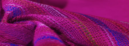 ruby red fabric with stripes of red-blue-green lines, very light elastic jersey, light sheen. texture background, pattern postcardの写真素材