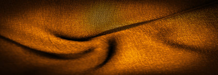 Background texture Dark sepia brown-yellow chiffon silk is a soft transparent fabric with a slight roughness (matte, creped) due to the use of twisted yarn.の写真素材
