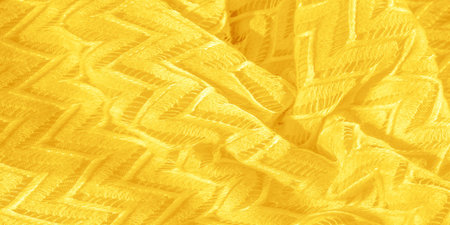 yellow fabric, multi-layered silk lace, premium plain winter knitted shawl. Texture, background,...