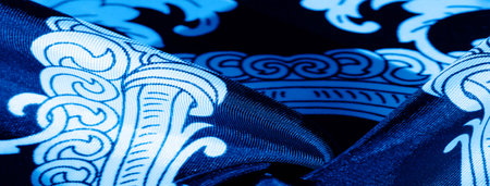 Blue and white monogrammed silk fabric. An exquisite pattern of filigree fabric. texture, backgroundの写真素材