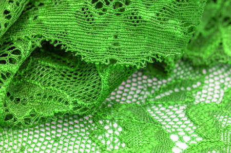 Green lace. Elastic fashionable textile jacquard lace. Decorative item for sexy lingerie. elastic tapes. Home decor. Texture for your design. background. template.の写真素材