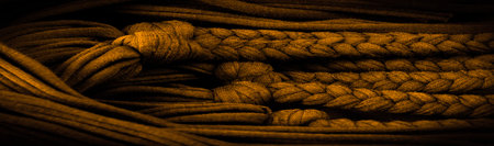 Texture, background, pattern. Fabric in yellow braids. Knitted knitted background with embossed...