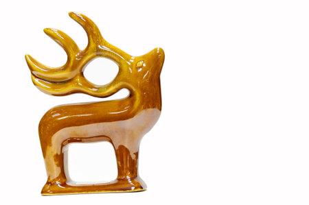 Swap meet. Antique deer figurine, glazed ceramics A ceramic is any of the various hard, brittle, heat-resistant and corrosion-resistant materials made by shaping and then firing a nonmetallic mineralの写真素材