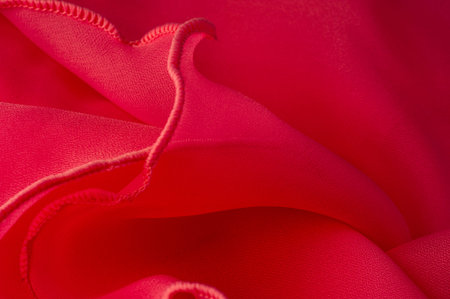 Texture. Background. Pattern. Red silk folded fabric background, banner or cover design. luxurious...