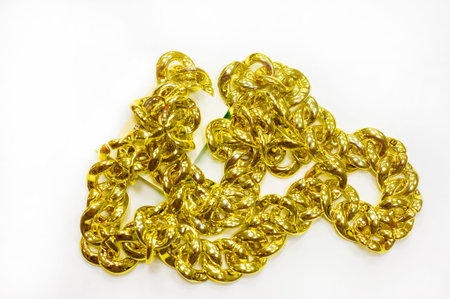 Gold chain to be worn around the neck. A chain is a sequential assembly of connected parts, made of...