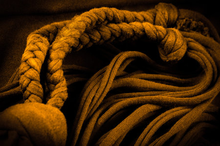 Texture, background, pattern. Fabric in yellow braids. Knitted knitted background with embossed...