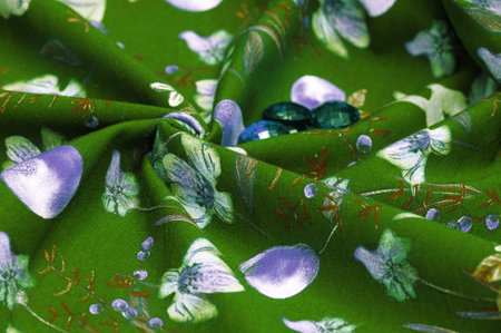Cotton, green background with a print of bunnies and fruits. The jersey fabric is so named because...