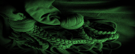 Texture, background, pattern. Fabric in green braids. Knitted knitted background with embossed...