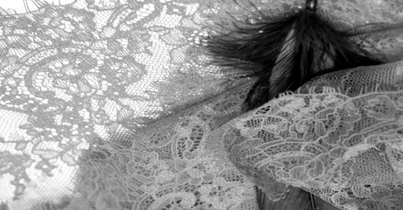 lace fabric. bird feather. lace color pale black on a white background. Texture, pattern. When it's time to choose the right pattern for your needs, you can count on my textures.の写真素材