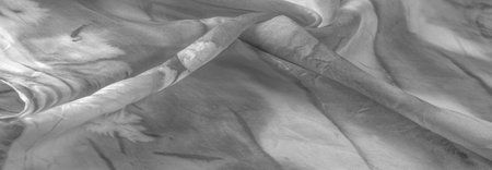 Black and white fabric with streaks of gray spots on a white background. Abstract designer fabric fancy designer. Beautiful background for your design. Texture. Picture. drawing, pattern, figureの写真素材