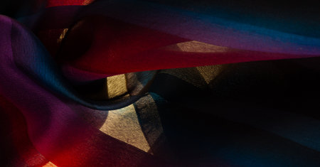 The silk scarf is dark in color. Green red blue blurred stripes. Delicate long gradient color stole, soft hand feeling, stylish and comfortable. The scarf will add sophistication to your look.の写真素材