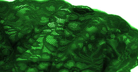 Green lace. This stunning and sophisticated fabric will be a true work of art. Intense green with delicate lace patterns that we love so much; unique, elegant and vibrant.の写真素材