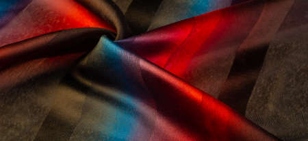 The silk scarf is dark in color. Green red blue blurred stripes. Delicate long gradient color stole, soft hand feeling, stylish and comfortable. The scarf will add sophistication to your look.の写真素材