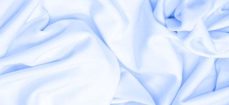 White silk fabric. Texture. Background. Pattern. Dupioni silk fabric has a shiny sheen and...