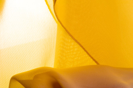 Texture. template. yellow silk polyester. Background from yellow silk fabric. Textured background...