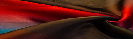 The silk scarf is dark in color. Green red blue blurred stripes. Delicate long gradient color stole,...