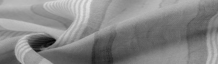 Texture. Background. Monochrome gray silk fabric, a photograph or picture developed or executed in...