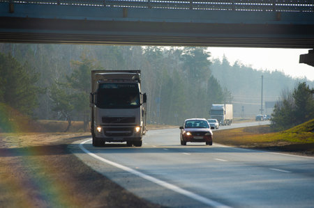 Freight road transportation. Transport companies accept goods for road transport. Many truckers own their own trucks (rig) and are known as owner-operators. Russia Chelny 05 11 2020のeditorial素材